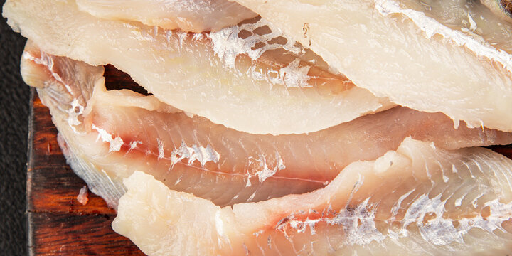 Whiting fish raw fillet fresh seafood  pescetarian diet tasty snack fresh delicious gourmet food background on the table rustic food top view copy space