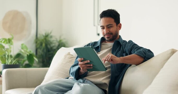 Smile, man and relax at house with tablet, social media and streaming movies for weekend break. Happy, male person and digital in home for research, download ebook and watching comedy video in lounge