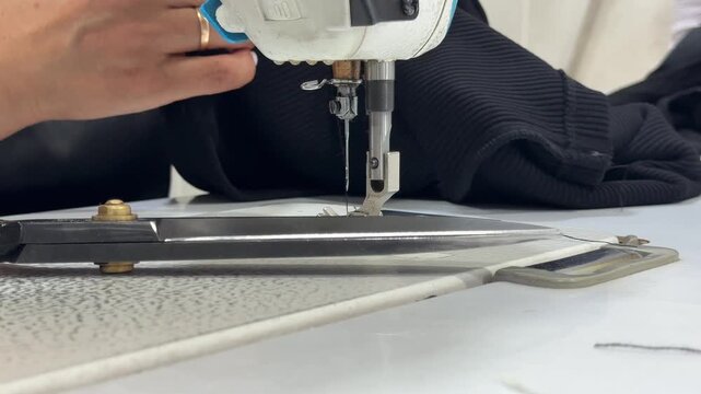man working on a sewing machine
