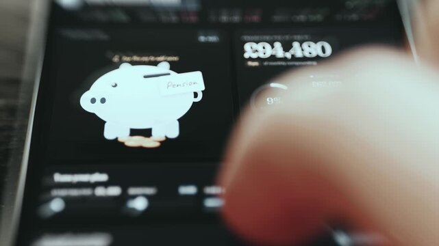 Person using a compound interest and savings tracking app with a targeted 1M GBP goal