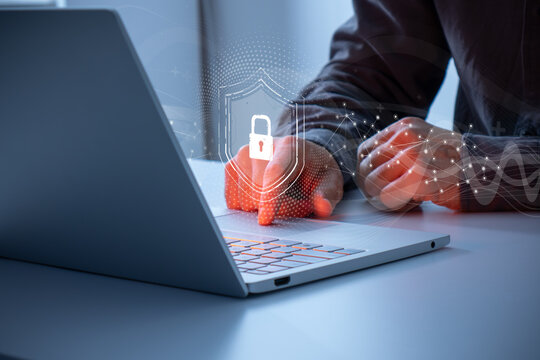 Man interacting with a holographic lock icon. Concept of data protection, cyber security, privacy, network security system, personal data, verification, secure access and security transaction.