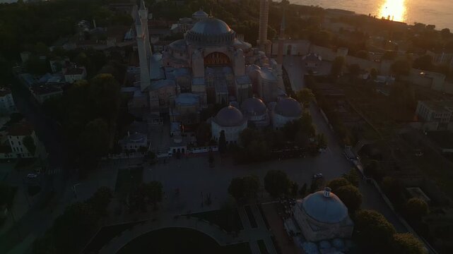 Aerial Tilt Up from Square to Hagia Sophia Mosque at sunrise in 4k