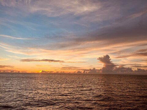 sunset, ocean, twilight, horizon, purple, seascape, sea, sky, water, dramatic, nature, calm, evening, dusk, silhouettes, islands, serene, landscape, reflection, atmosphere, peaceful, light, view, clou
