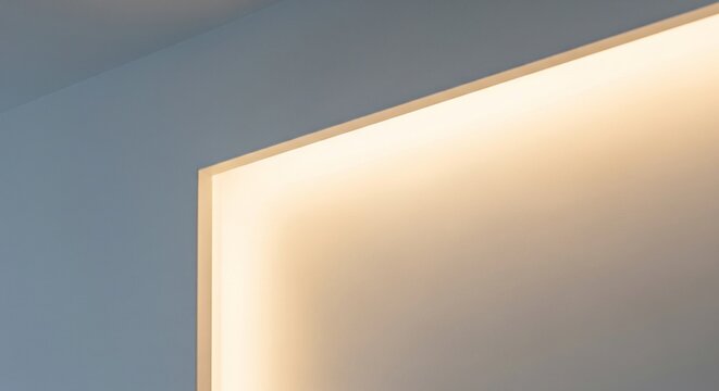 Warm hidden LED backlight built into a white ceiling niche or wall edge.