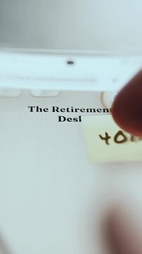 The Retirement Desk with a 401k term on a sticky note