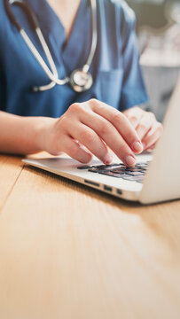 Healthcare professional working on patient documents