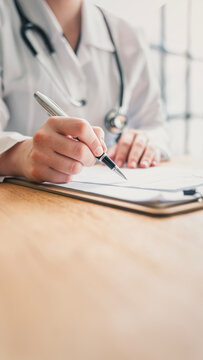 Medical doctor completing administrative healthcare records

