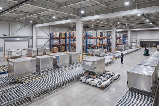 Air Freight Processing Facility with air freight handling lanes and logistics workers, wide interior view for Air Freight Logistics Promotion
