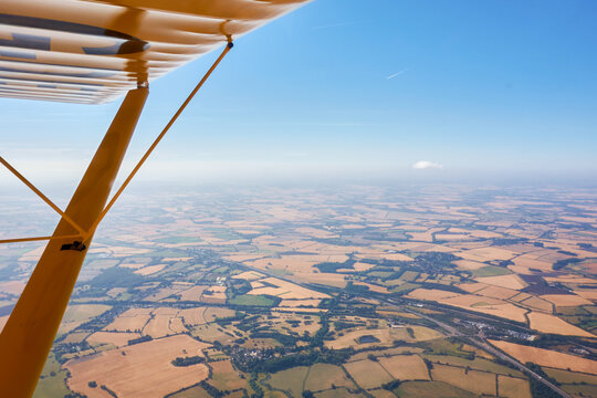 Aerial View of East Anglia Farmland from Yellow Light Aircraft on Summer Day