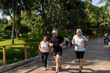 Fototapeta premium Group jogging in sunny park