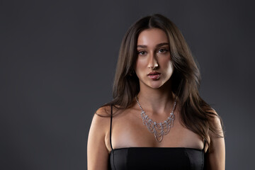 Naklejka premium Young woman posing in a studio for beauty and fashion concepts