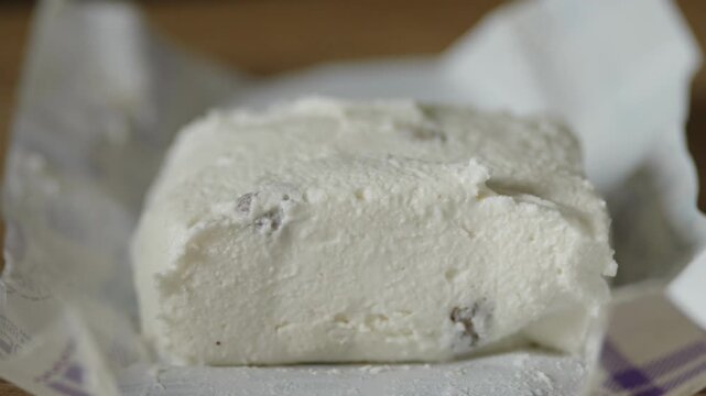 Macro shot of sweet cottage cheese mass with raisins wrapper