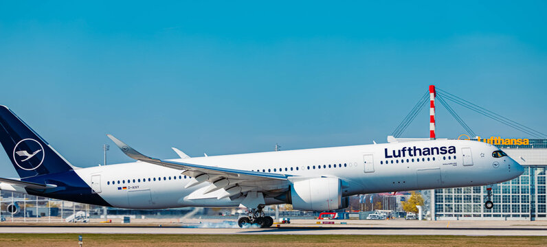 D-AIXY Lufthansa Airbus A350 passenger jet airplane touchdown with smoking tires on a sunny spring day at Munich airport, MUC, Freising, Bavaria, Germany