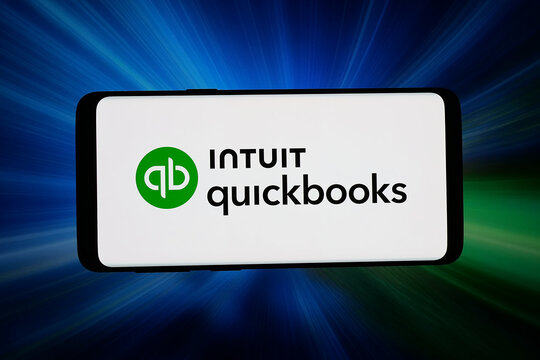Stuttgart, Germany - 06-11-2026: In this photo illustration, the logo of US accounting software QuickBooks (Intuit) is displayed on a smartphone in front of abstract background on computer screen.
