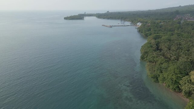 Coastal Aerial Reveal Of Sebesi Village Jetty And Reef Lampung