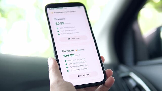 Scrolling through a list of features on a weight loss app. The screen highlights smart planning, weight tracking, and daily macro health checks. Great for showcasing health technology, personalization