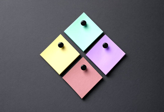Diamond arrangement of colorful sticky notes pinned on a dark background