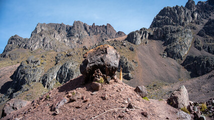 Large solitary boulder on the mountain ground in the Peruvian Andes. © frankhs