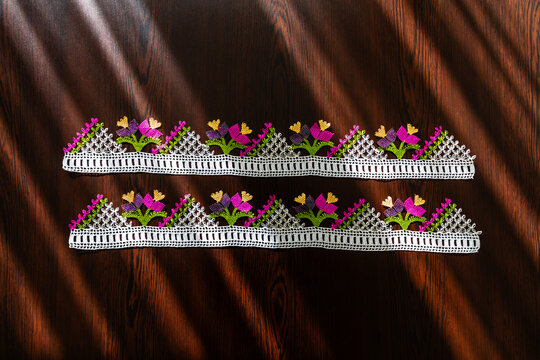 Hand-crocheted lace on the background. Handmade lace used in dowries and decorative embellishments.