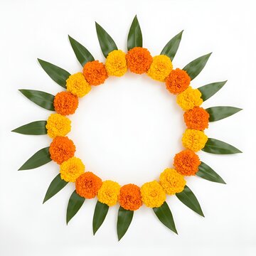 flower rangoli made using marigold or zendu flowers and mango leaves over plain background with copy space in the middle, selective focus
