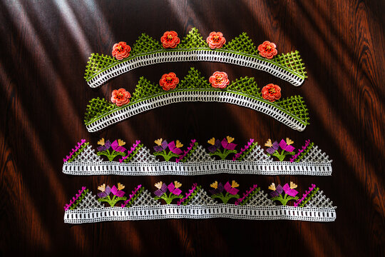 Hand-crocheted lace on the background. Handmade lace used in dowries and decorative embellishments.