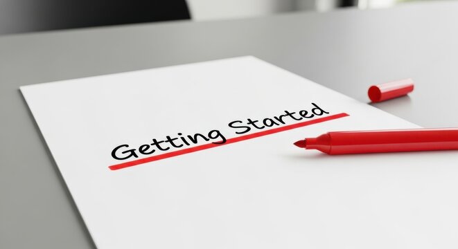 Getting Started concept written on white paper, underlined in red with a marker, signifying new beginnings and instructions.