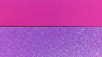 Horizontal split background with vibrant magenta paper and sparkling violet glitter surface. Two tone festive backdrop featuring matte fuchsia texture and shimmering purple glitter cardboard.