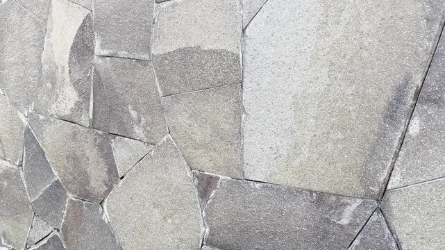 Cinematic Sunlight Exposure on Textured Natural Stone Wall Cladding