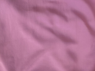 Fototapeta premium Landscape Close-up of Soft Pink Fabric Texture with Folds