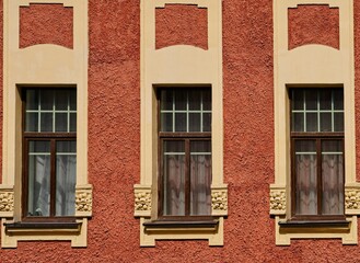 Fototapeta premium Three large windows on the facade of a modern house