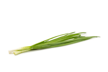 Fototapeta premium Green onions isolated on white background. Sliced ​​green onions in a bowl on the table. Fresh herbs on a cutting board. Organic natural greens. Vegan. Space for text. Copy space.