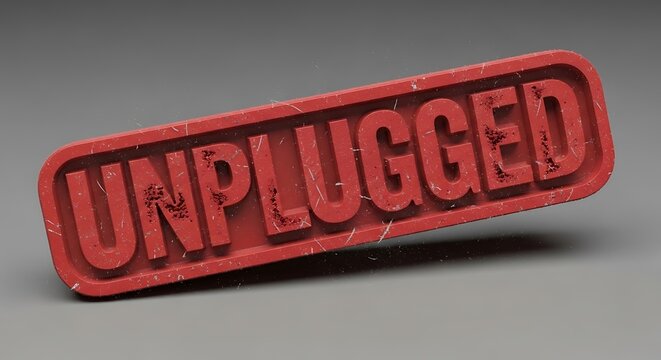Red rubber stamp imprint of the word unplugged on a gray background