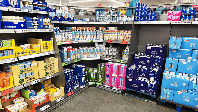 Iserlohn, Germany - May 22, 2026: Supermarket aisle stocked with dairy and plant based products including milk, cream, and alternative drinks inside PENNY supermarket