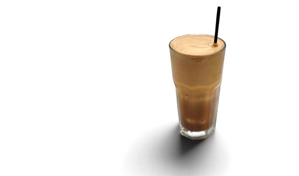 Photo of a frappe coffee with rich foam isolated on white background. A classic Greek iced drink made with instant coffee, water, sugar and milk (optional) for a creamy, refreshing taste.