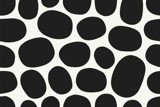 Seamless abstract pattern features irregular black pebble like spots on a clean off white background for modern design.