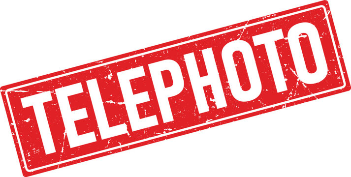 A graphic rubber stamp impression with the words TELEPHOTO in distressed white capital letters on a red rectangle