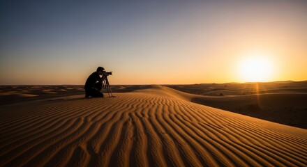 Fototapeta premium Photographer Captures Golden Desert Sunset Amidst Rippling Sand Dunes.