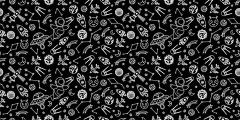 Space themed pattern background. Seamless pattern of space themed doodle pattern background. Hand drawn spaces doodle pattern background. Seamless space planet kid doodle universe design. © Predi