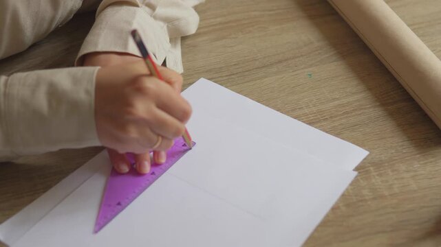 Hands Drawing with Triangle Ruler on Paper &ndash; Precision Planning and Design Process Concept