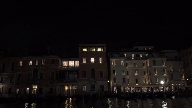 Quiet Venetian Canal at Night With Gondolas and Reflections