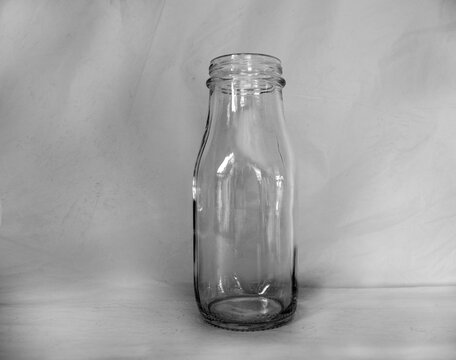 Empty glass jar in black and white