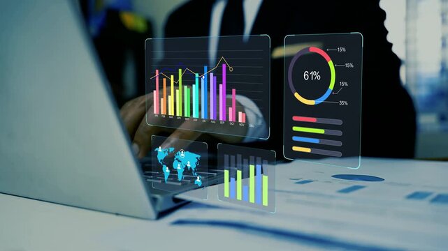 Business analytics dashboard with laptop in office, Business person using a laptop with holographic floating digital charts and data dashboards on a desk