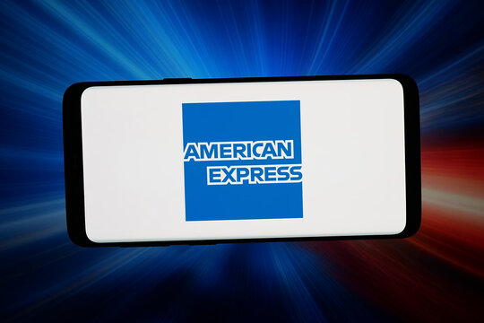 Stuttgart, Germany - 06-11-2026: In this photo illustration, the logo of US business American Express Company (Amex) is displayed on a smartphone in front of abstract background on computer screen.