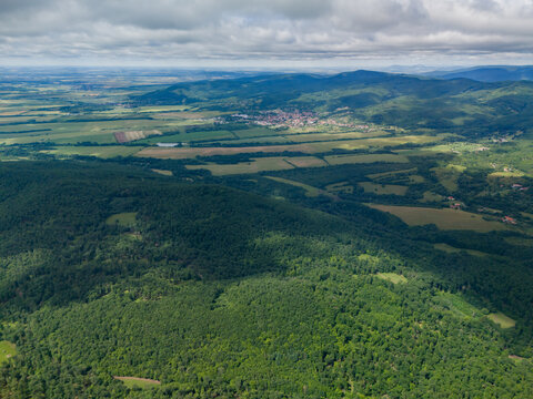 Aerial view of the Bohunicky Rohac peak in the Stiavnicke Vrchy mountains with lush green forests and rolling hills near Bohunice, Nitra Region, Slovakia.