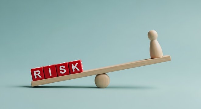 Risk management concept with wooden seesaw, red dice spelling risk balancing a wooden figure, financial stability and business assessment metaphor
