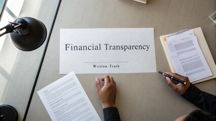 Fototapeta premium Concept of Financial Transparency on a Work Desk with Documents and Tools for Truthful Financial Practices