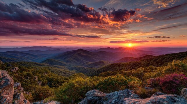 Dramatic sunset over layers of mountain ridges in Blue Ridge Mountains