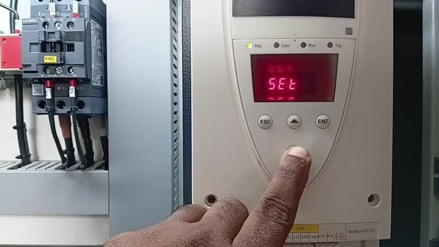 Configuring Parameters and Settings on a Three Phase Induction Motor Soft Starter Panel Close Up
