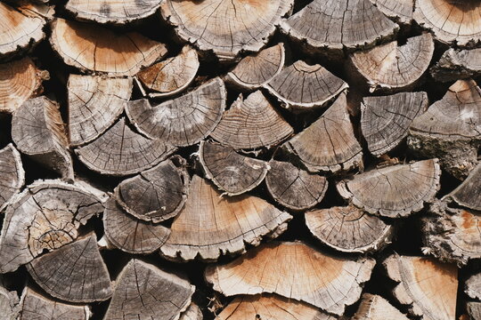 Earthy Brown Wood Grain Texture Background Rustic Chopped Firewood Stack with Tactile Surface Patterns for Copy Space and Organic Layered Design