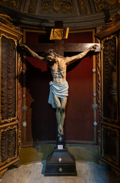 Wooden crucifix in a niche of  Sant'Andrea al Quirinale baroque styled church in Rome, XVII century work of the famous architect Lorenzo Bernini, Italy	